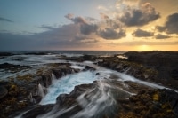 Sunset Over Lava Rocks Kona Big Island Hawaii.jpg