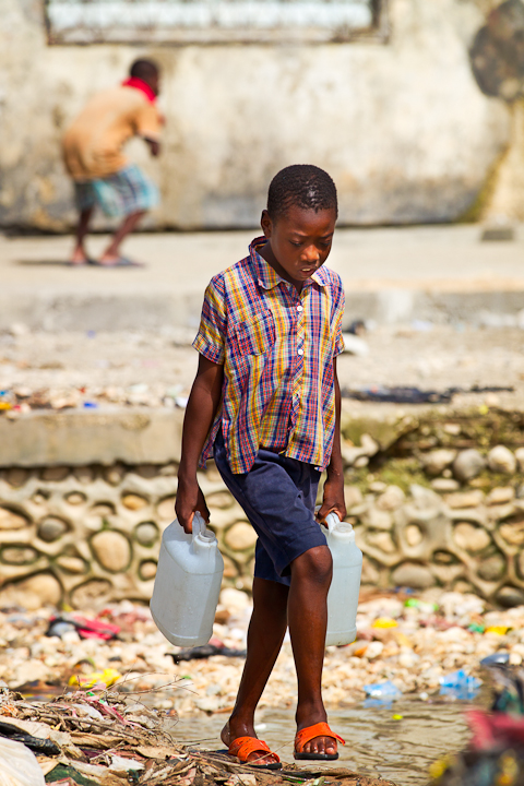 Boy Carrying water in Haiti
