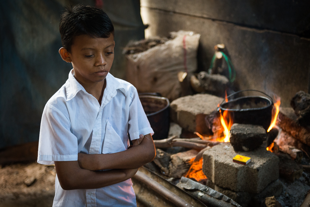 A Boy prepares breakfast in his home in the slums of Granada Nicaragua