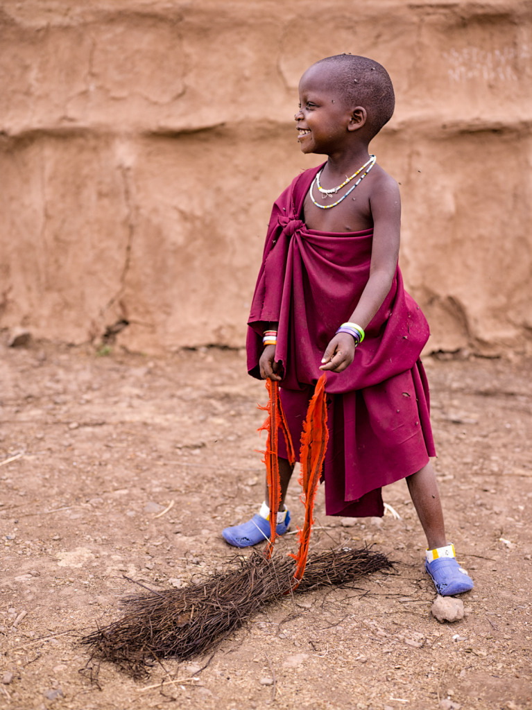 An image of a young Maasai girl getting ready to collect fire wood for her family that was taken with a Phase One IQ260