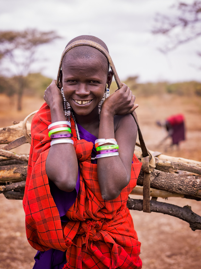 An image of a Maasai woman carring firewood back to her village taken with a Phase One IQ260