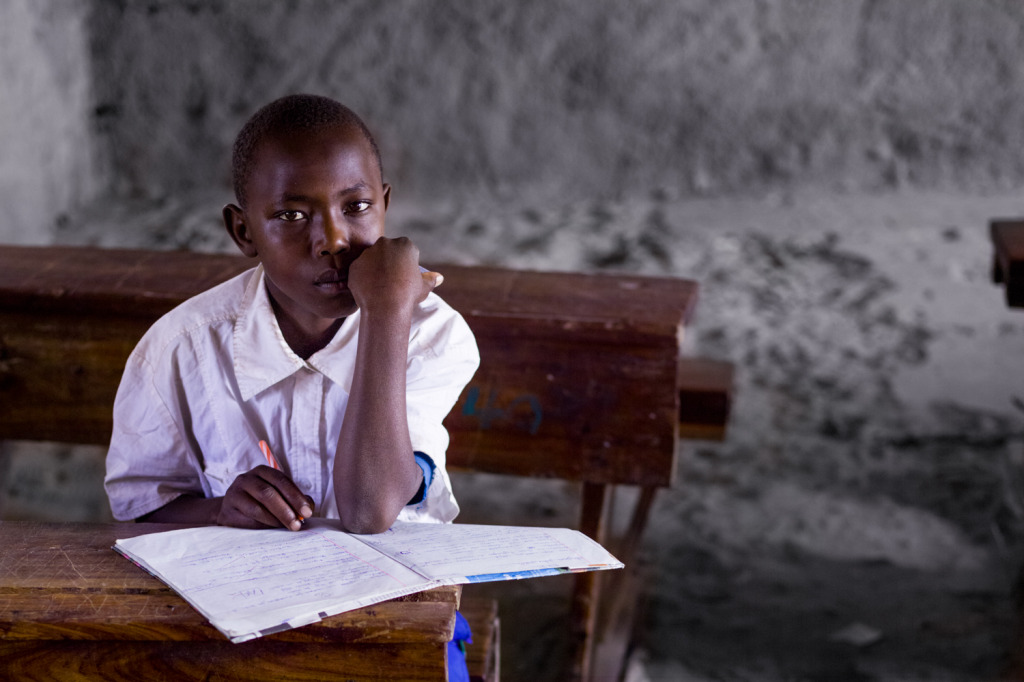 An image of a young boy that is hard at work in a school in Robanda, Tanzania that was taken with a Phase One IQ260