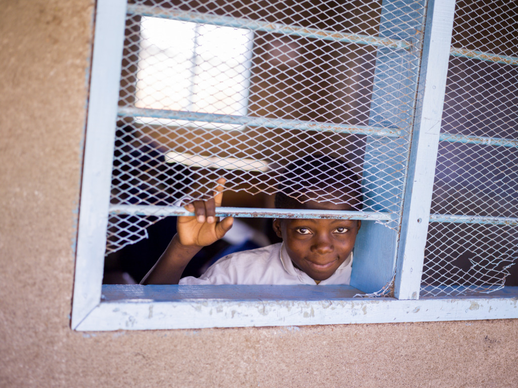 An image of a curious child in a low income school in Robanda, Tanzania taken with a Phase One IQ260