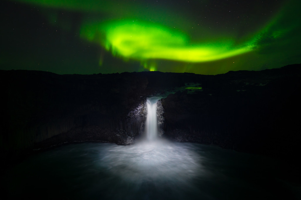 Using a flashlight to paint in light onto the Aldeyjarfoss Waterfall, in Northern Iceland
