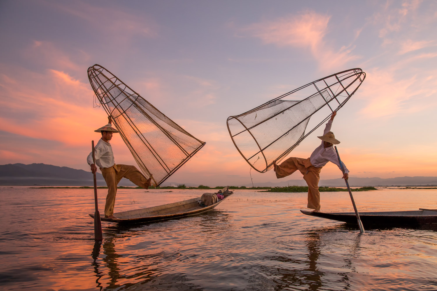 Inle Lake Sunset in Myanmar with two Fisherman