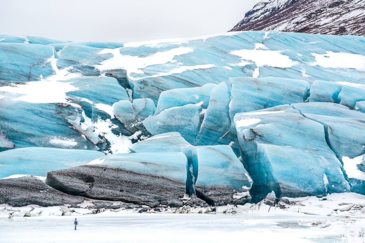 Man Hiking a Glacier at the Iceland Winter Photo Workshop