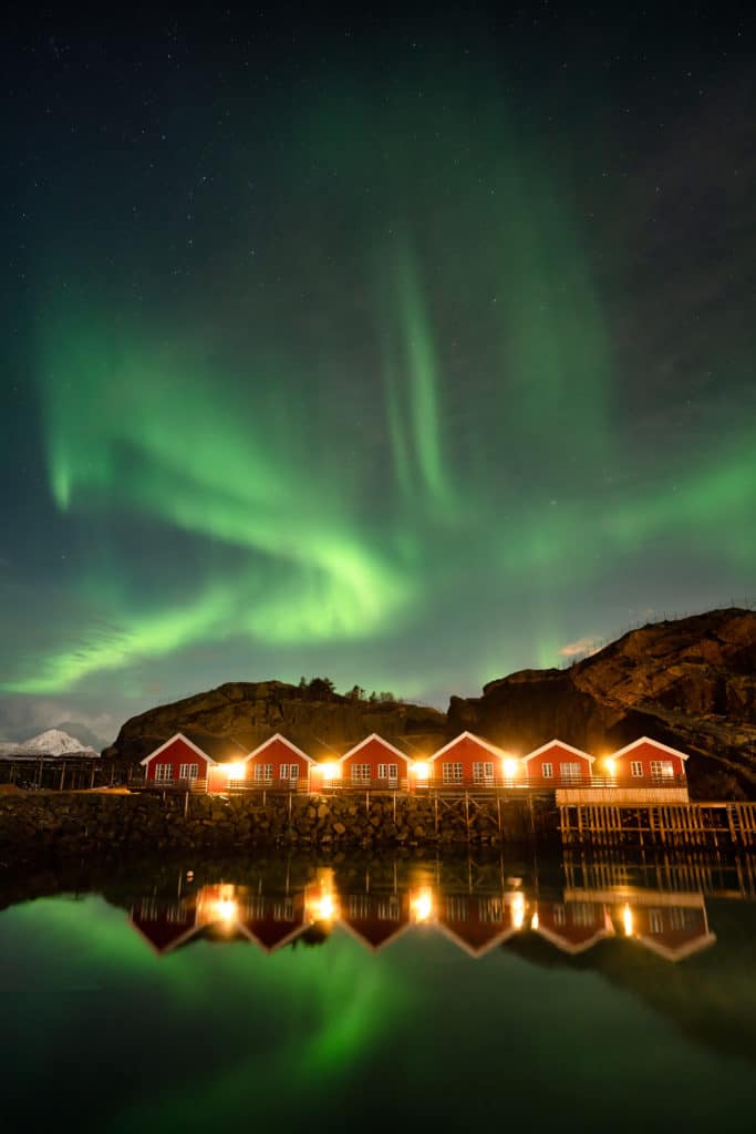 Northern Lights Over Cabins in Lofoten Islands Sony 20mm f/1.8 G Lens Review