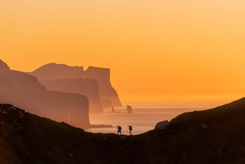 Hiking Around the Faroe Islands during the midnight sun catching the amazing colors of the sky with Colby Brown's Faroe Islands Photography Workshop