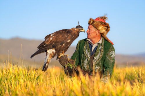 Eagle Hunter Bond with His Golden Eagle - Mongolian Photo Workshop Adventure with Colby Brown
